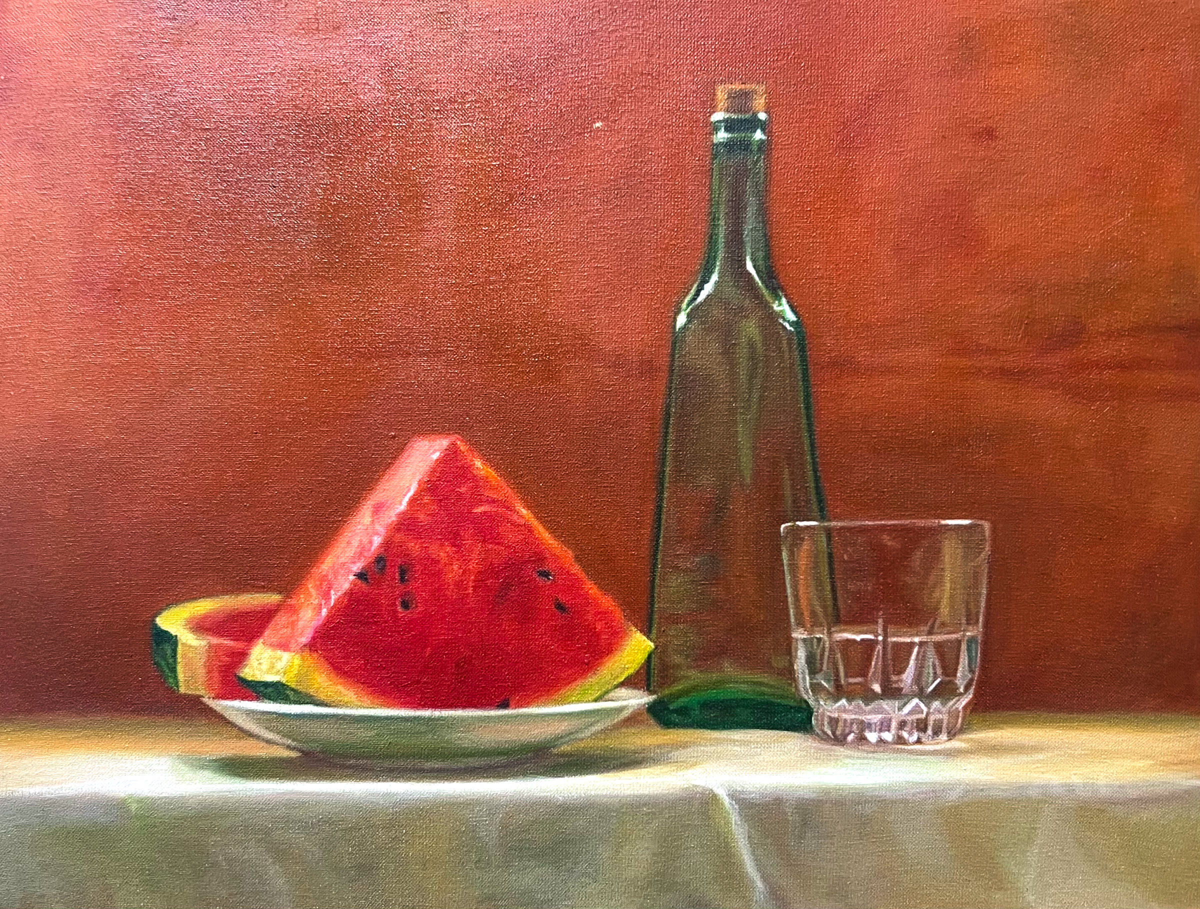 Oil still life with watermelon, a green bottle, and a glass